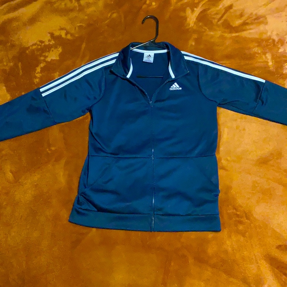 Adidas track jacket. Navy blue and white accent.